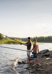 dad and son fishing on the lake